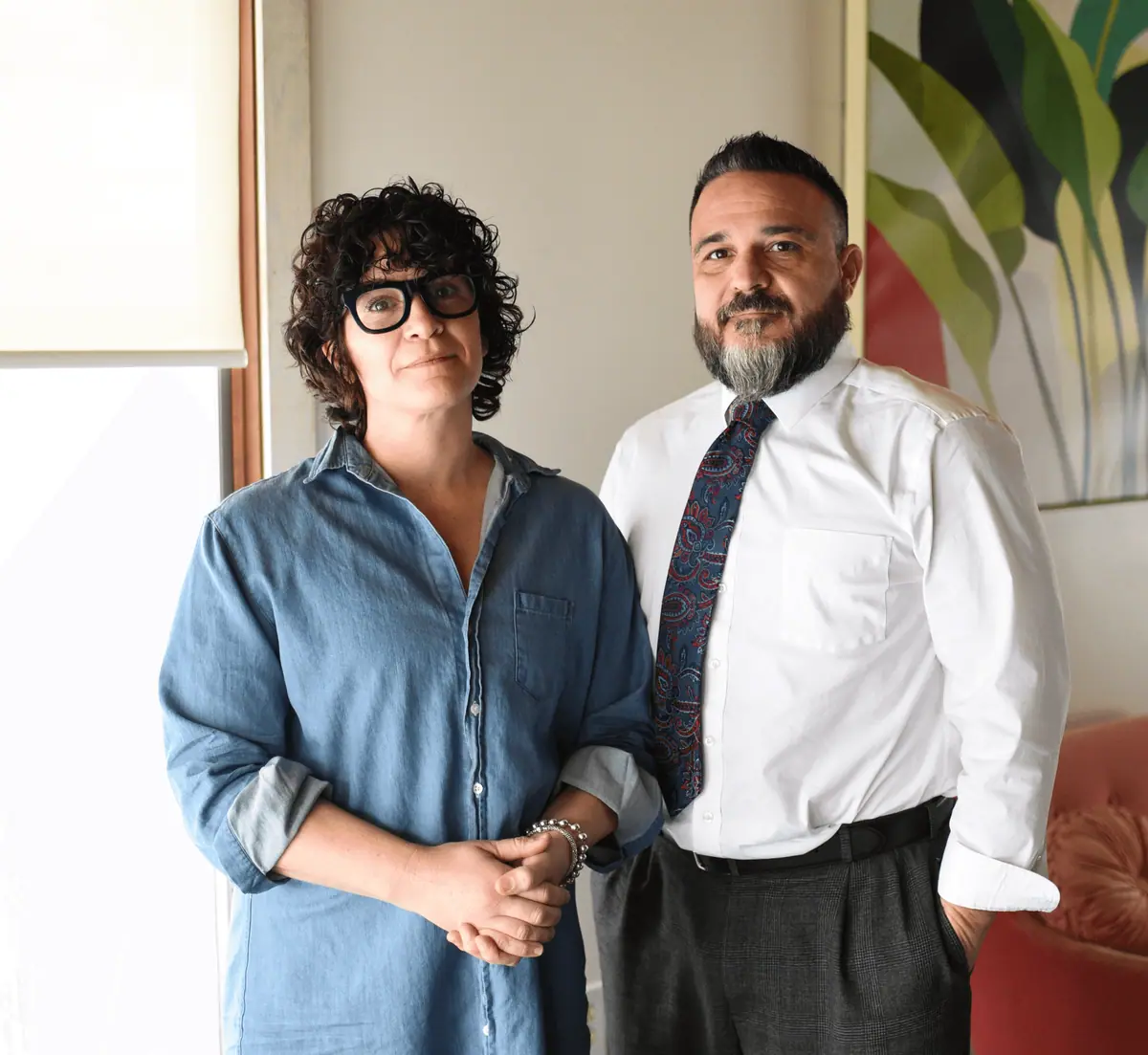 Breonna Frisk and Nicholas A. Frisk standing together in their office